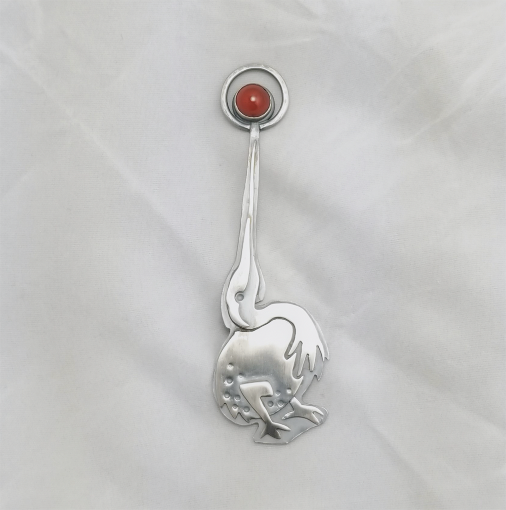 Silver bird with orange stone inspired by Bosch's Garden of Earthly Delights