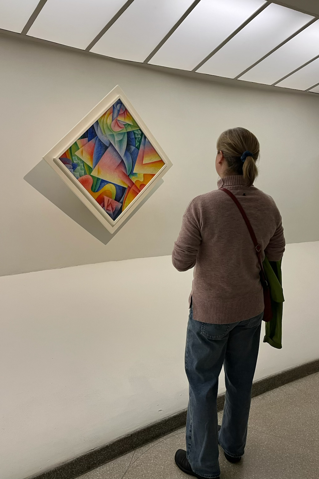 Zoe Jones in front of Gino Severini's Dancer=Propeller=Sea, part of the 1915 Harmony and Dissonance: Orphism in Paris, 1910-1930 exhibition at the Solomon R. Guggenheim Museum, New York. Photo courtesy of Jones