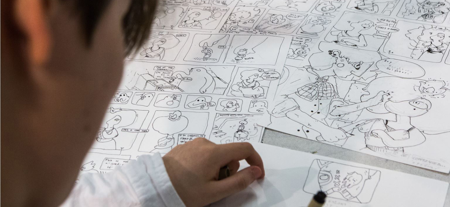 A cartooning student in the Summer Visual Art Academy