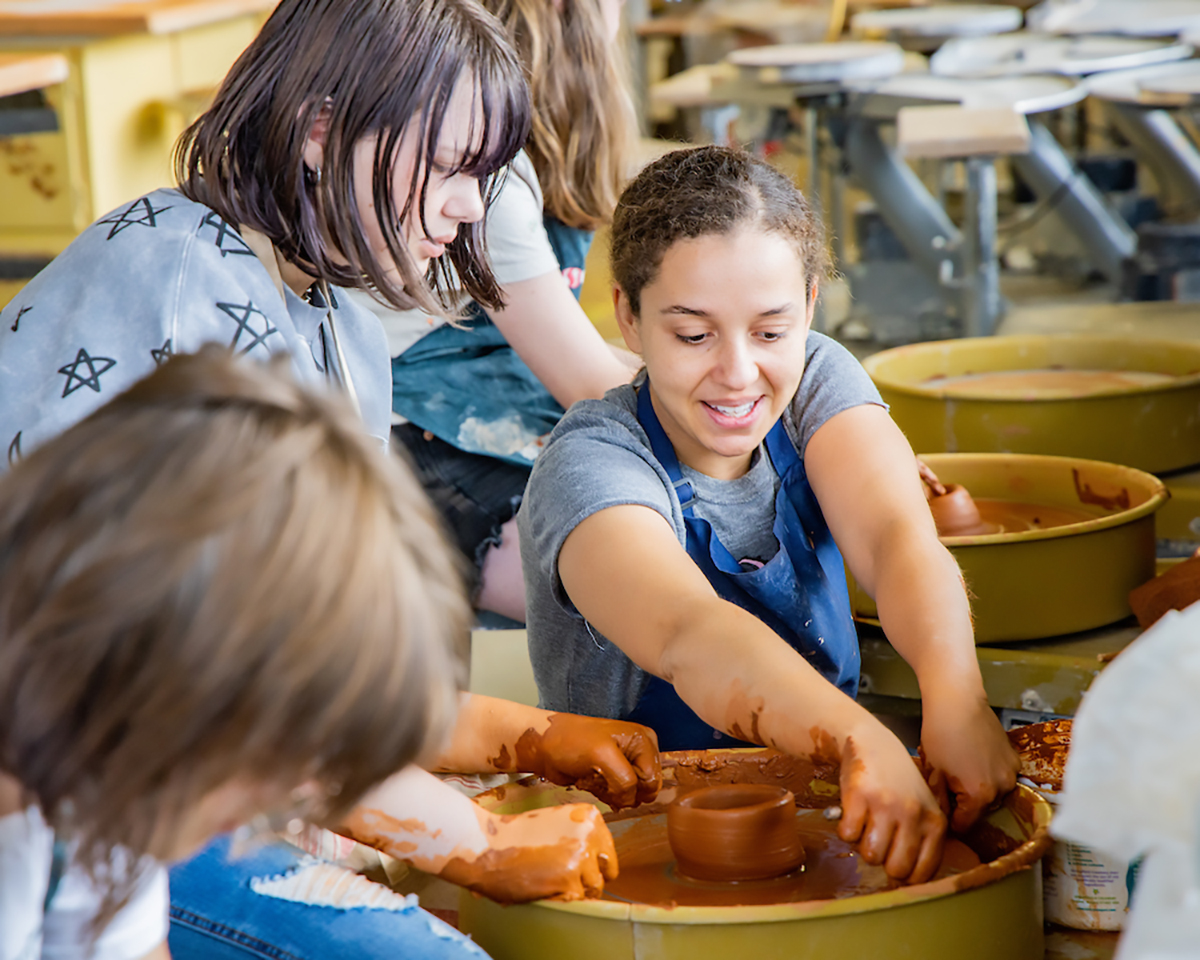Shaylise Sylvester helps students work on their ceramic pieces during the 2024 Summer Visual Arts Academy at the UAF Art Department in the Fine Arts Complex on the UAF campus Wednesday, June 12, 2024. UAF Photo by Marina Barbosa Santos