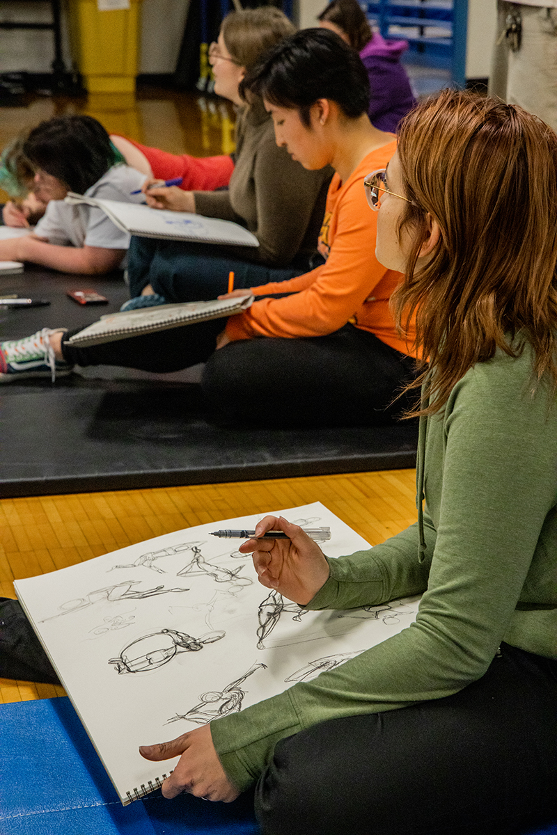 UAF's Art Department drawing instructor James Smith takes his Life Drawing class to an Aerial Arts Club meeting on October 17, 2023 in the Student Recreation Center. UAF Photo by Marina Barbosa Santos