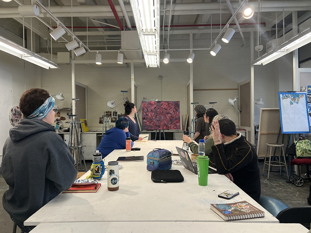 Students gather in the painting studio for critiques