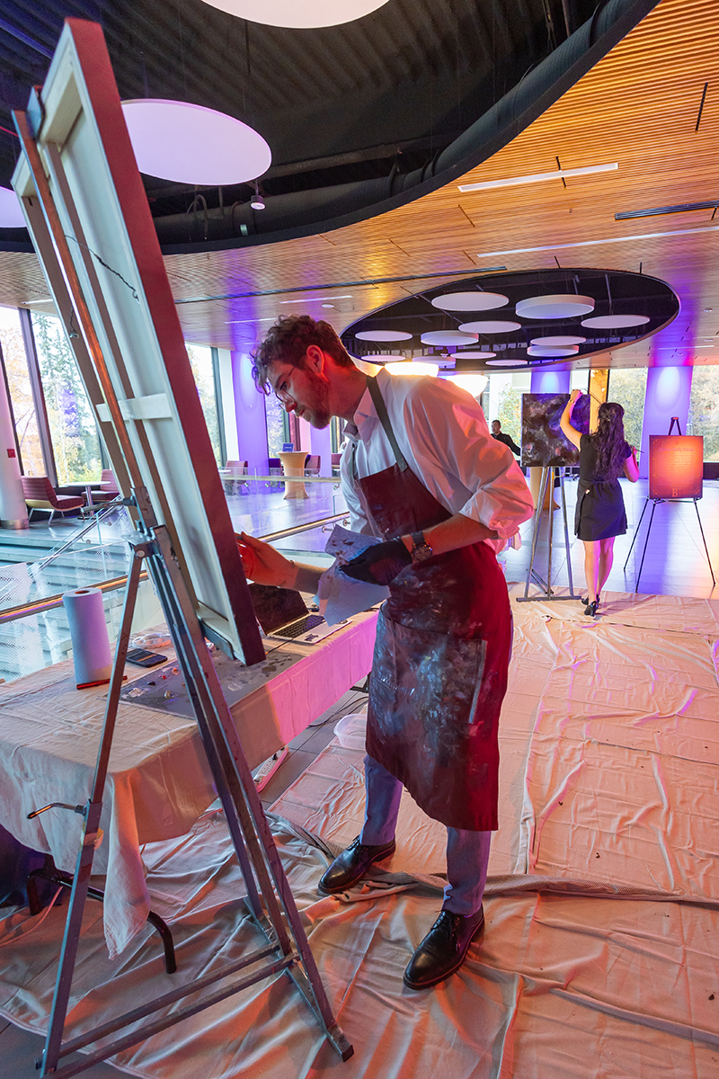 Fin Ludwig and Ayona-Reily Dixon live painting during the 2025 Blue and Gold Gala. UAF Photo by Eric Engman
