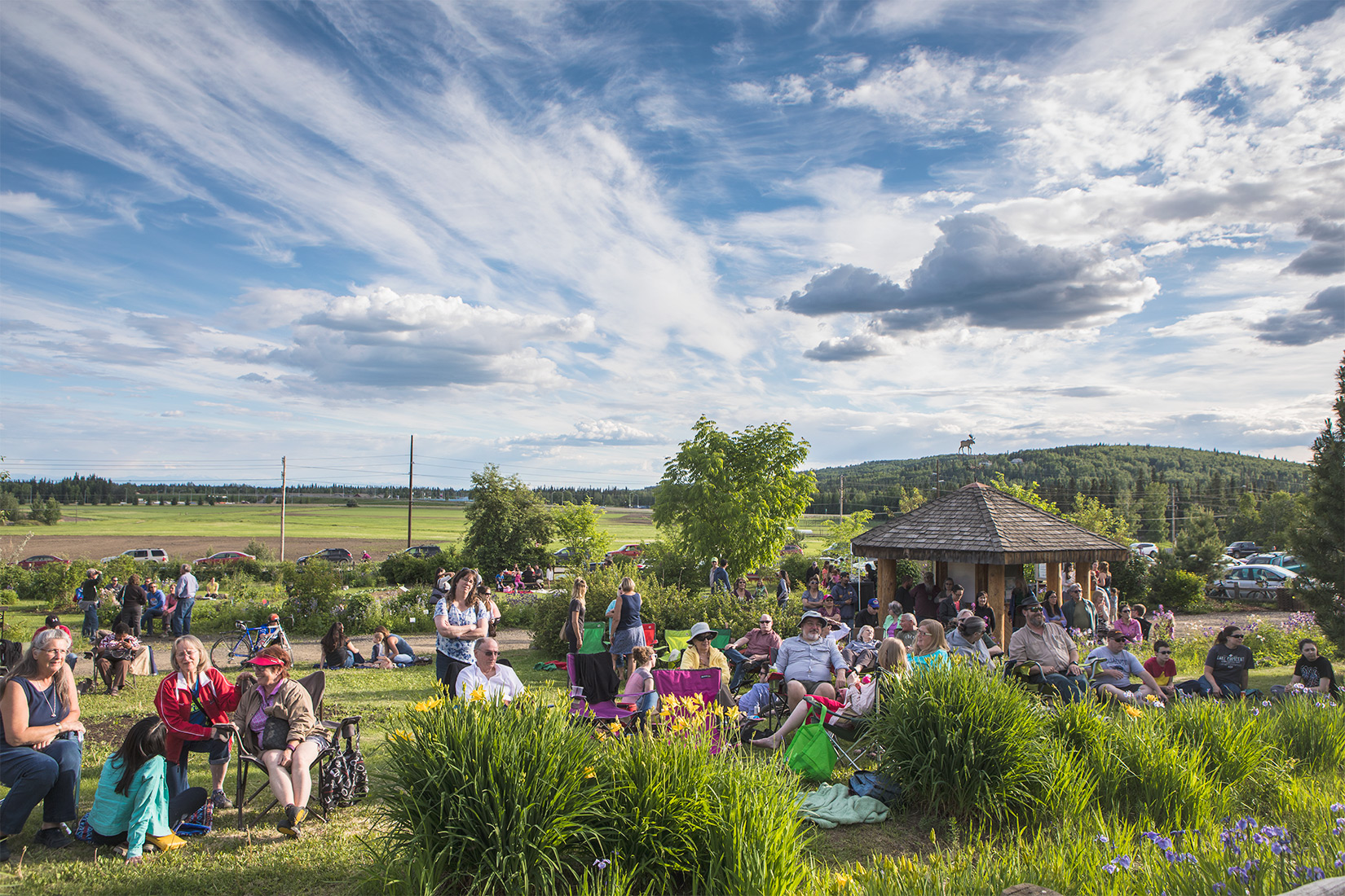 People gather at the Georgeson Botanical Garden for a musical performance in June 2017. UAF Summer Sessions arranges the Music in the Garden series of concerts on Thursday evenings in summer. UAF photo by JR Ancheta.