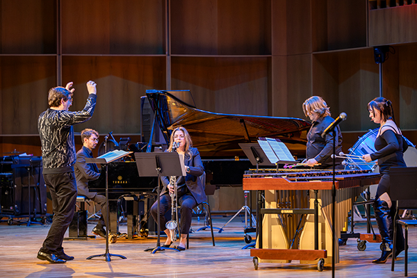 Sean Dowgray conducts John Luther Adams’ Dark Wind to life with Dario Martin (piano), April Jaille (bass clarinet), along with UAF students Madelyn Guffey (marimba) and Jack Greenwell (vibraphone) at the Circumpolar Music Series Winter Chamber Concert on February 21, 2025. UAF photo by Leif Van Cise.