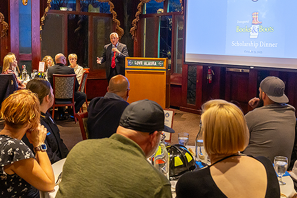 Jay Ramras, owner of Pike's Waterfront Lodge, speaks at the Boots and Books Scholarship Dinner on Oct. 23, 2025. UAF photo by Eric Engman.