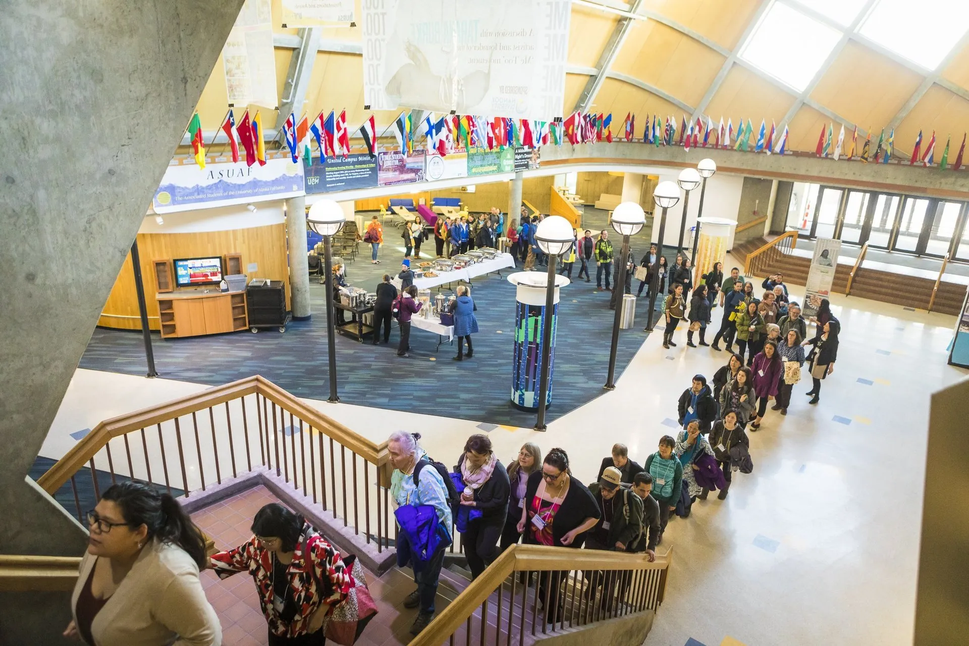 Group walking up the stairs at the Wood Center