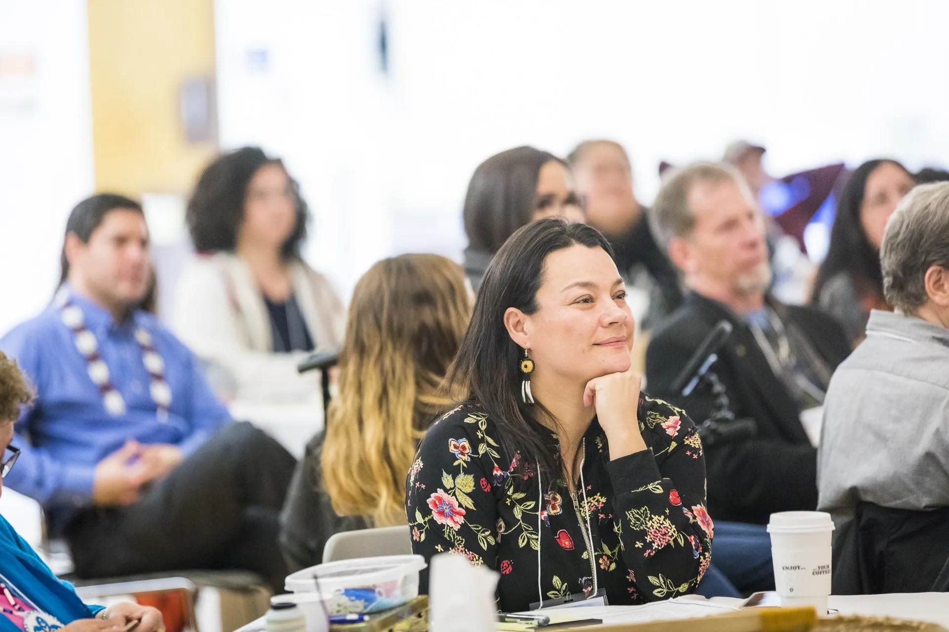 Jessica Black and other participants listening during the session.