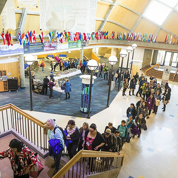 Group walking up the stairs at the Wood Center