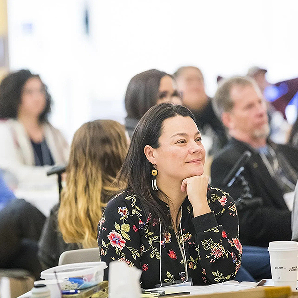 Jessica Black and other participants listening during the session.