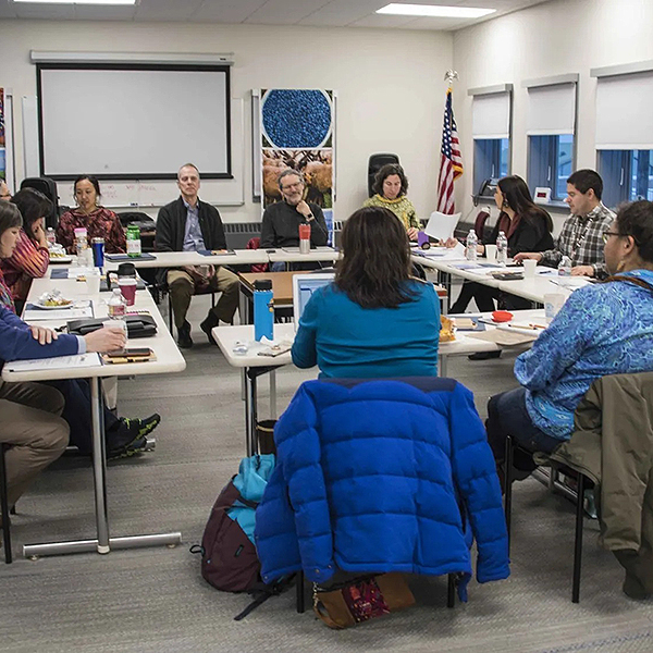 Participants around the table during a session.