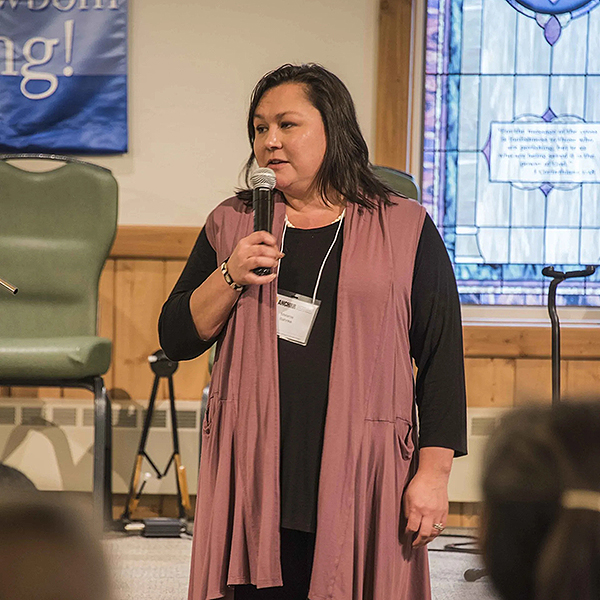 Melanie Banke speaking during a session.