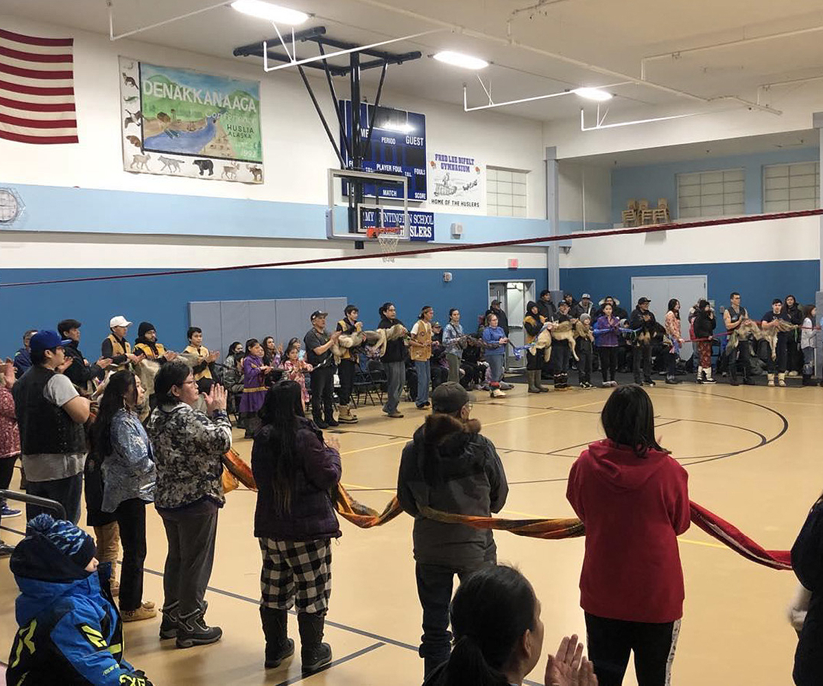 Community gathering in the school gym.