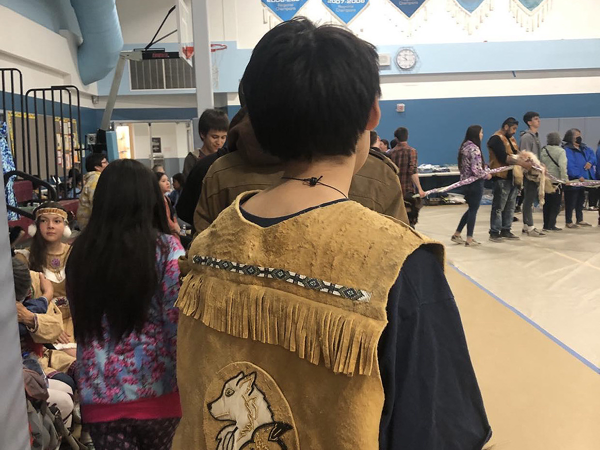 Community enjoying storytelling in the gym