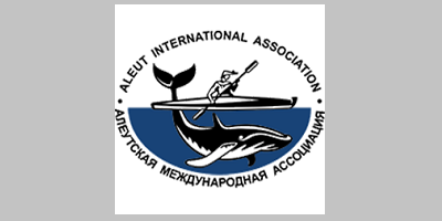 AIA logo - a person in a kayak on the ocean with a whale swimming underneath