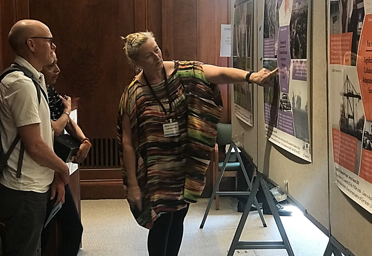 CAPS Director Amy Lovecraft presents posters at the Arctic Futures 2050 Conference in 2019