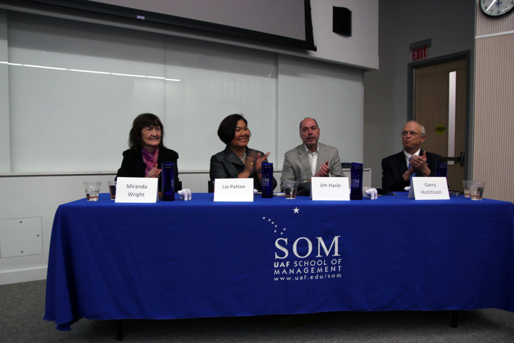Panelists Miranda Wright of Doyon Limited, Lia Patton of BDO, Jim Hasle of BDO, and Garry Hutchison of Kohler, Schmitt, and Hutchison applaud Julie Stricker at the opening of the seminar