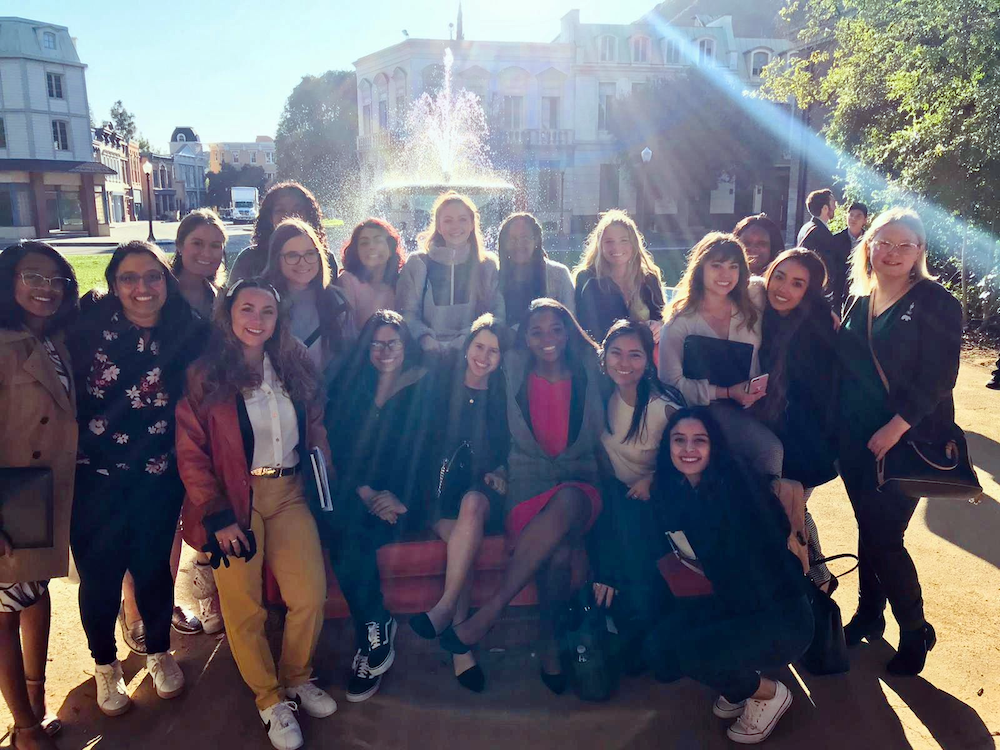 Class photo in front of a fountain