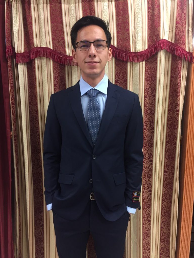 Eric Andersen poses in suit from Frank's Menswear