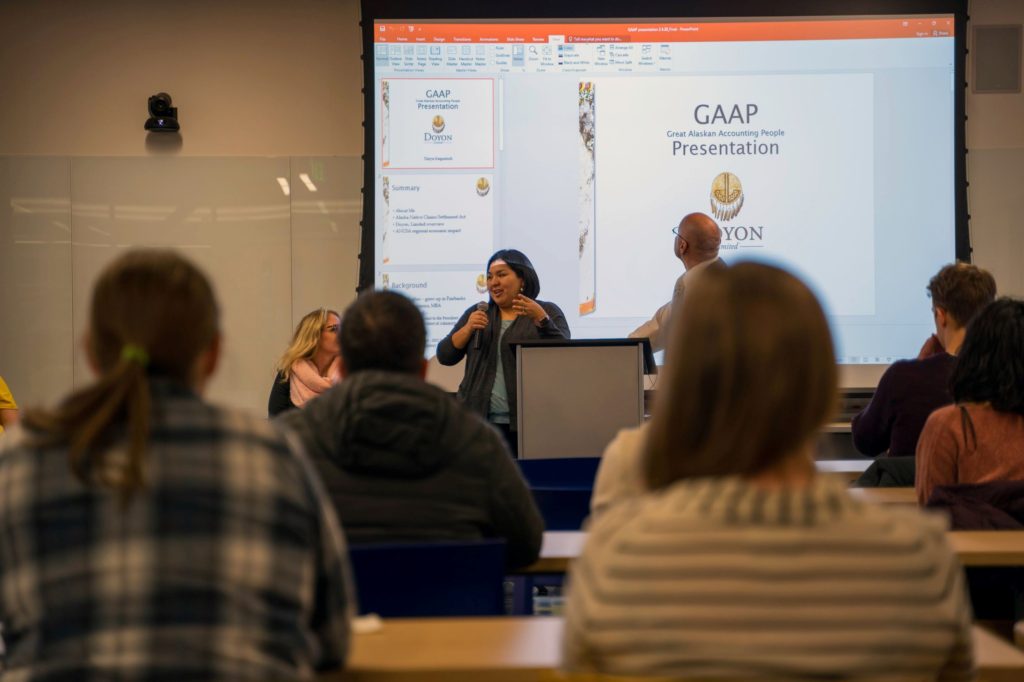 woman presents to classroom