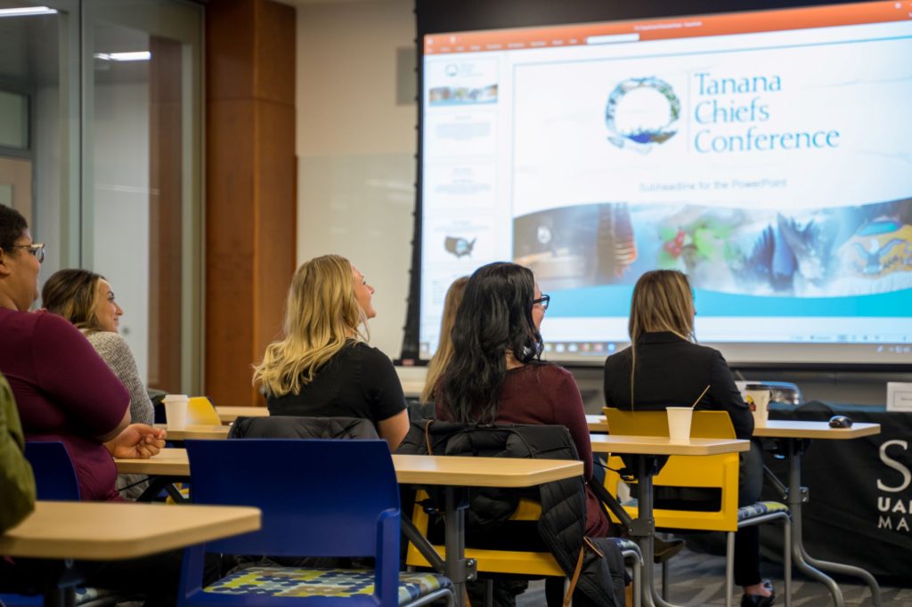 class smiles during Tanana Chief's Conference presentation