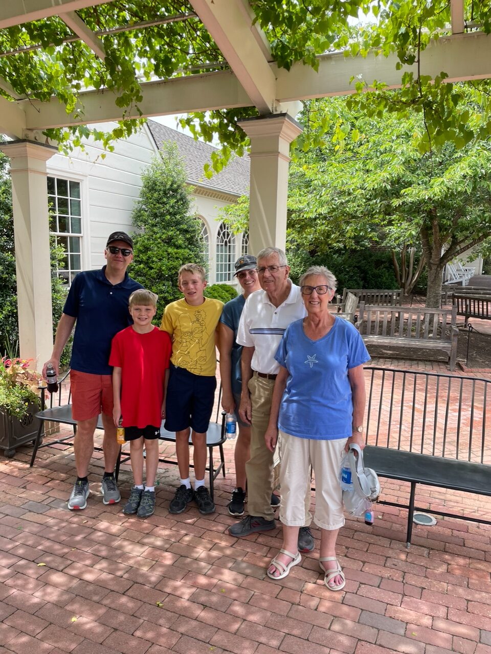 Ben, second from right, posing with family while on a trip in June 2022