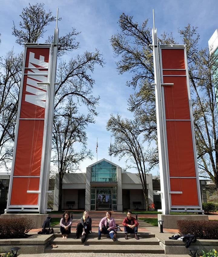Students sitting down on steps