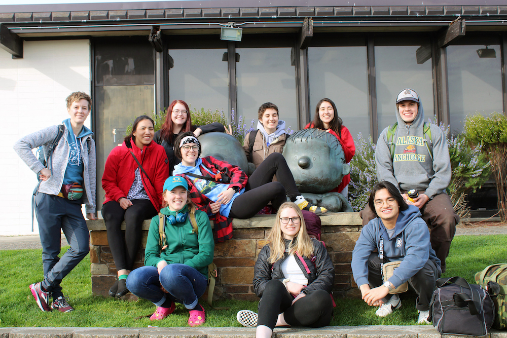 Class Posing with a statue