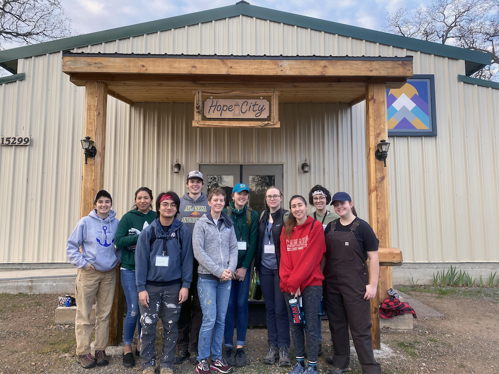 Class photo in front of Hope City building