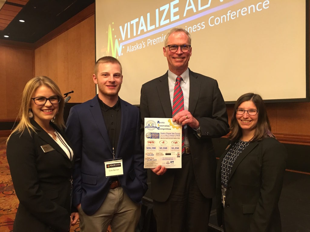 Paige Best, Cole Berner, UA President Jim Johnsen, and Claire Everts