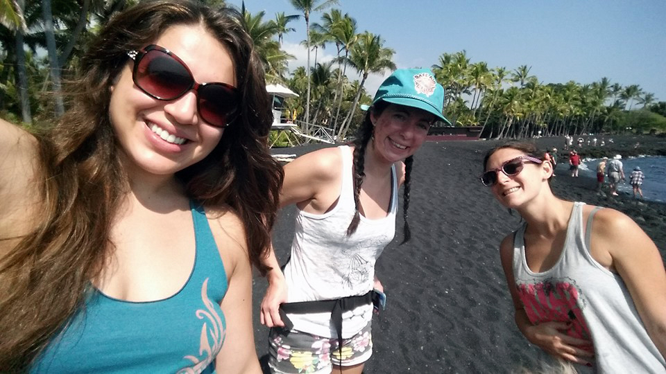 Micaiah on a black sand beach.
