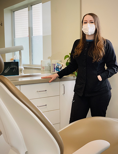 Maddy Case smiles for photo in dentist office