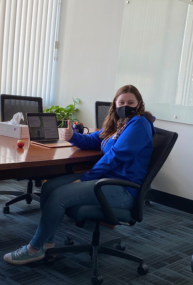 student works in conference room