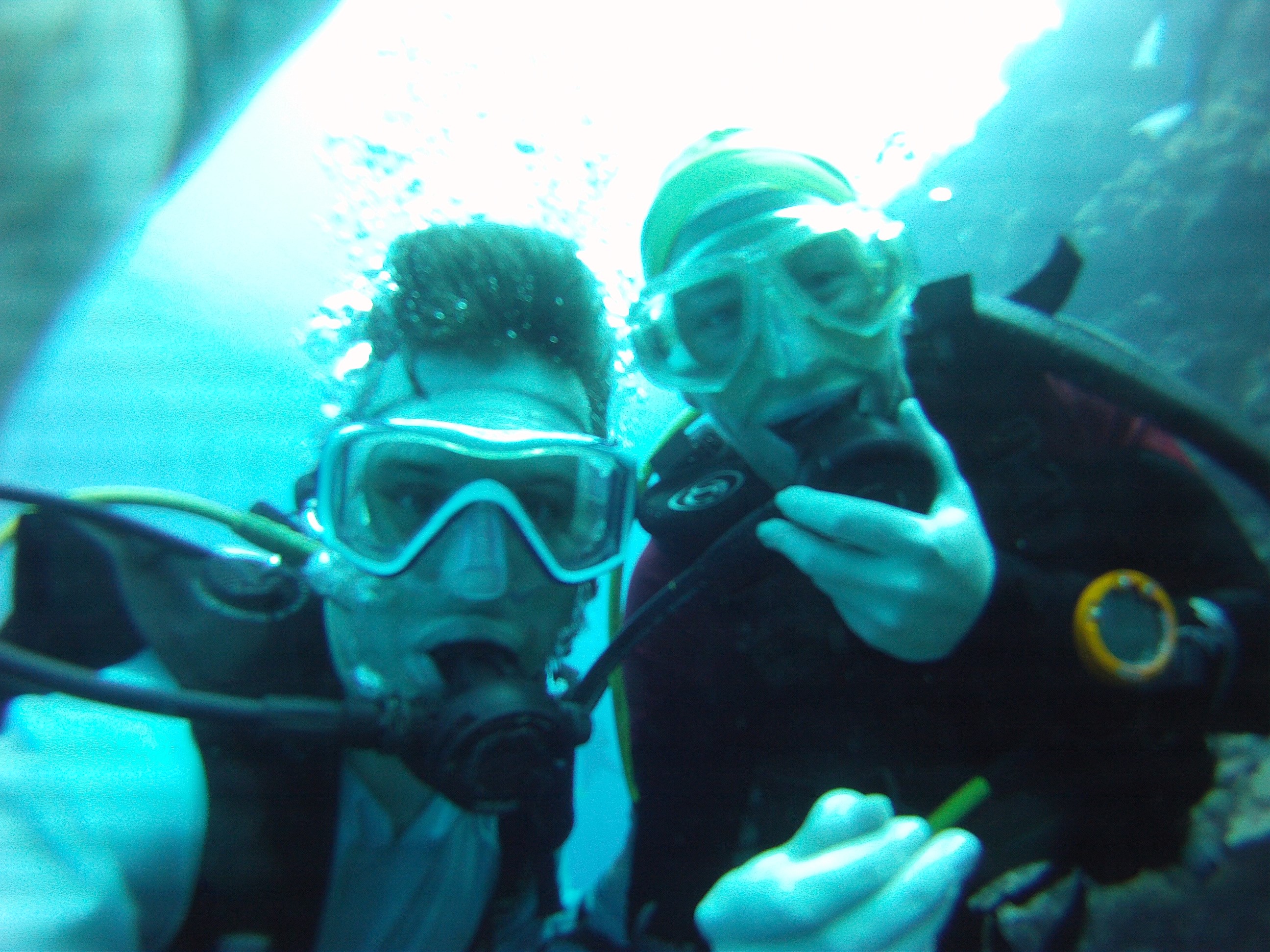 underwater selfie taken by two scuba divers