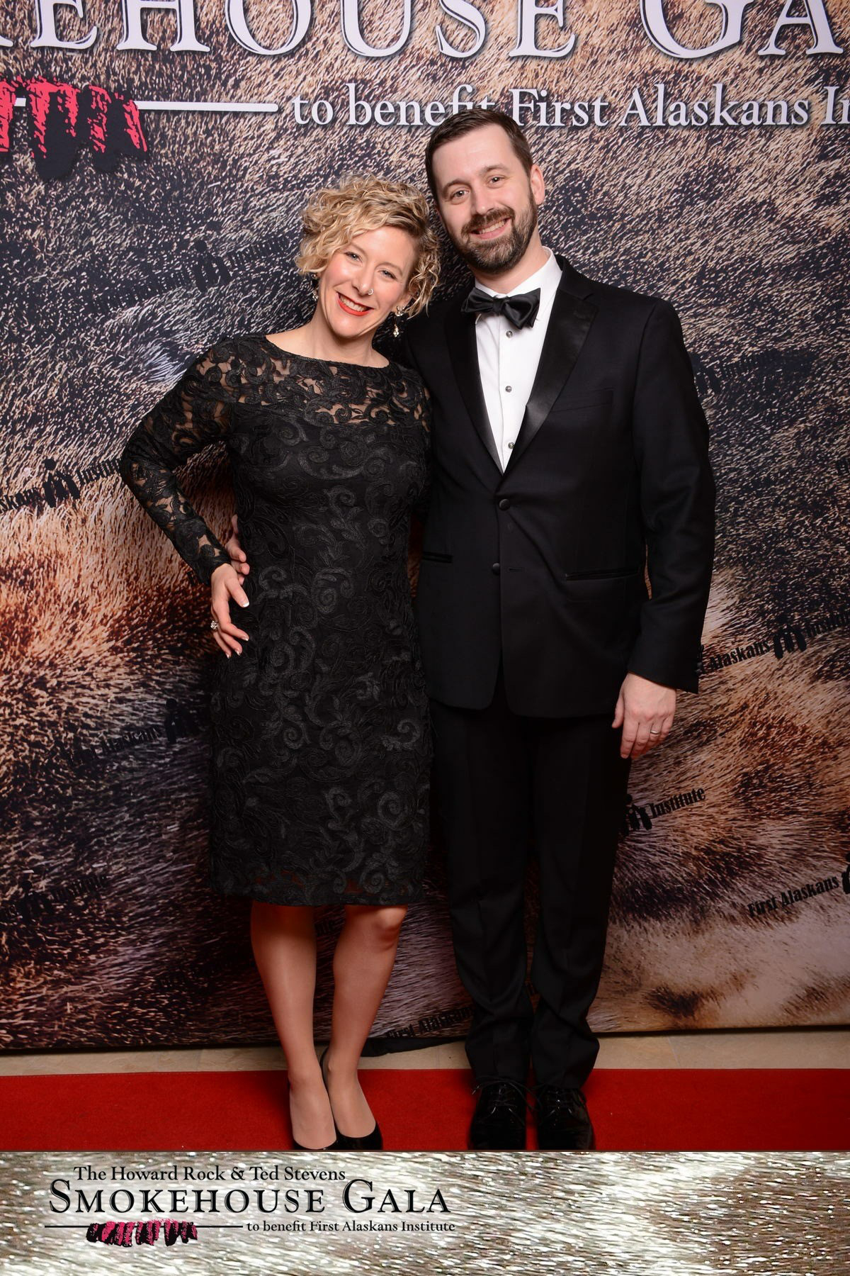 couple takes photo in the Smokehouse Gala photobooth