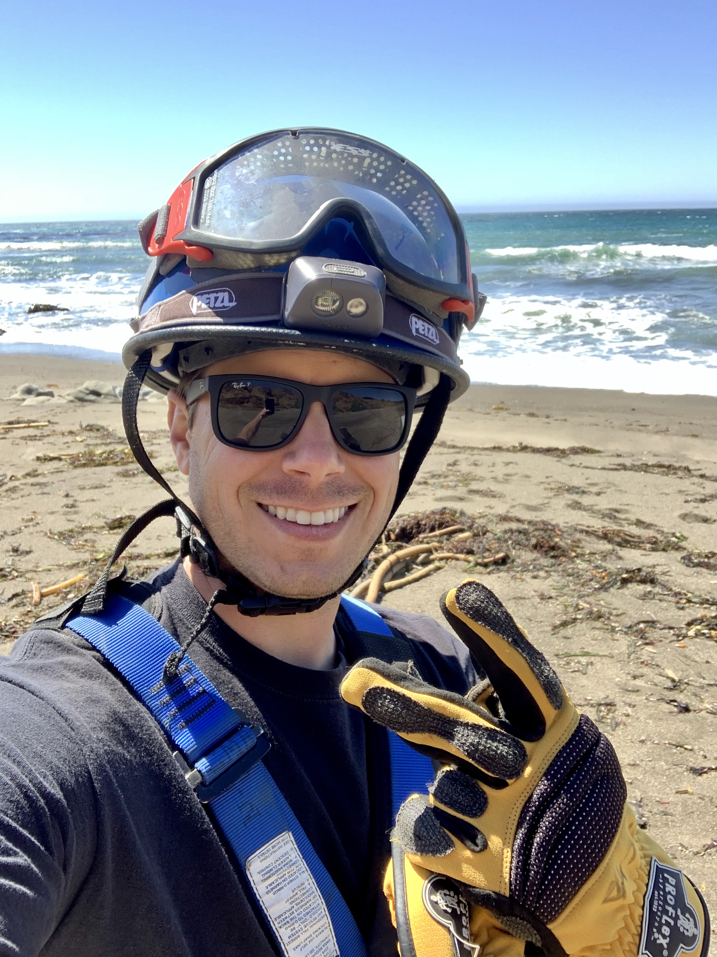 man takes selfie on beach
