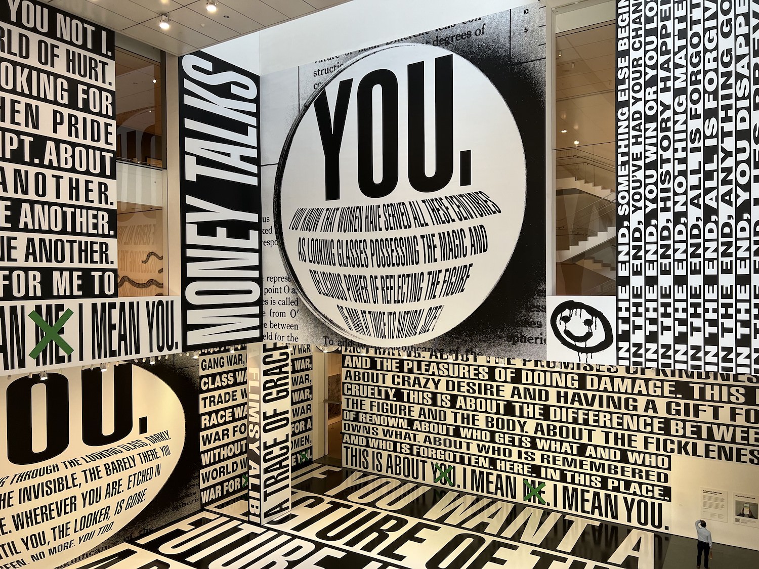 museum room with kaleidoscopic black and white text on walls, floor and ceiling
