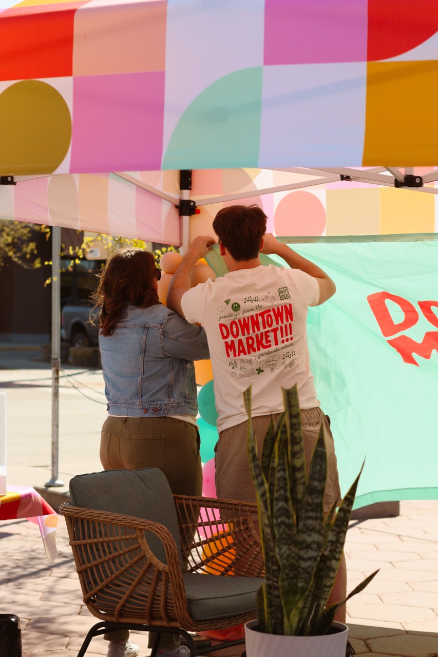 couple sets up tent at Downtown Market