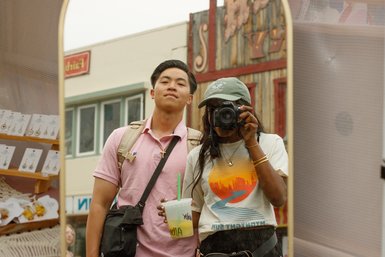 couple takes selfie in mirror