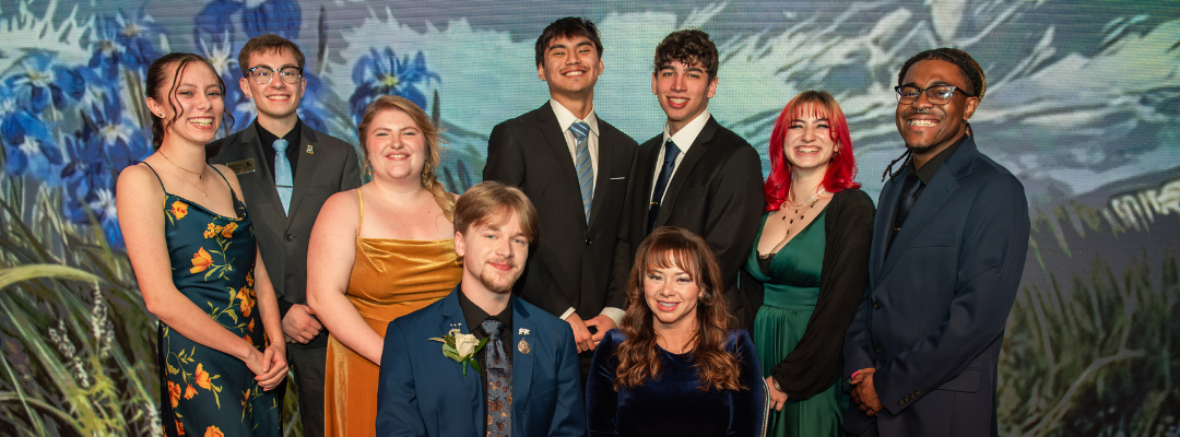 students smile at photo booth