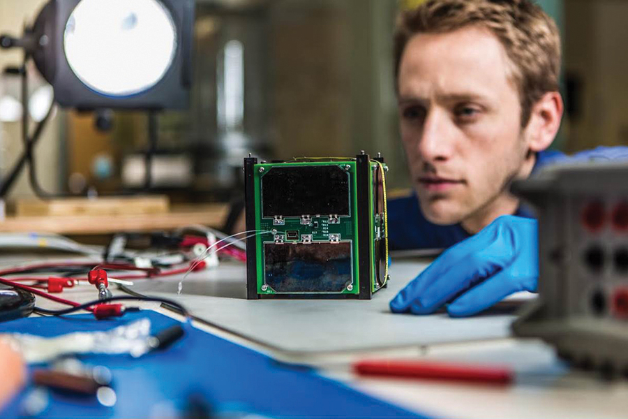 Student with CubeSat