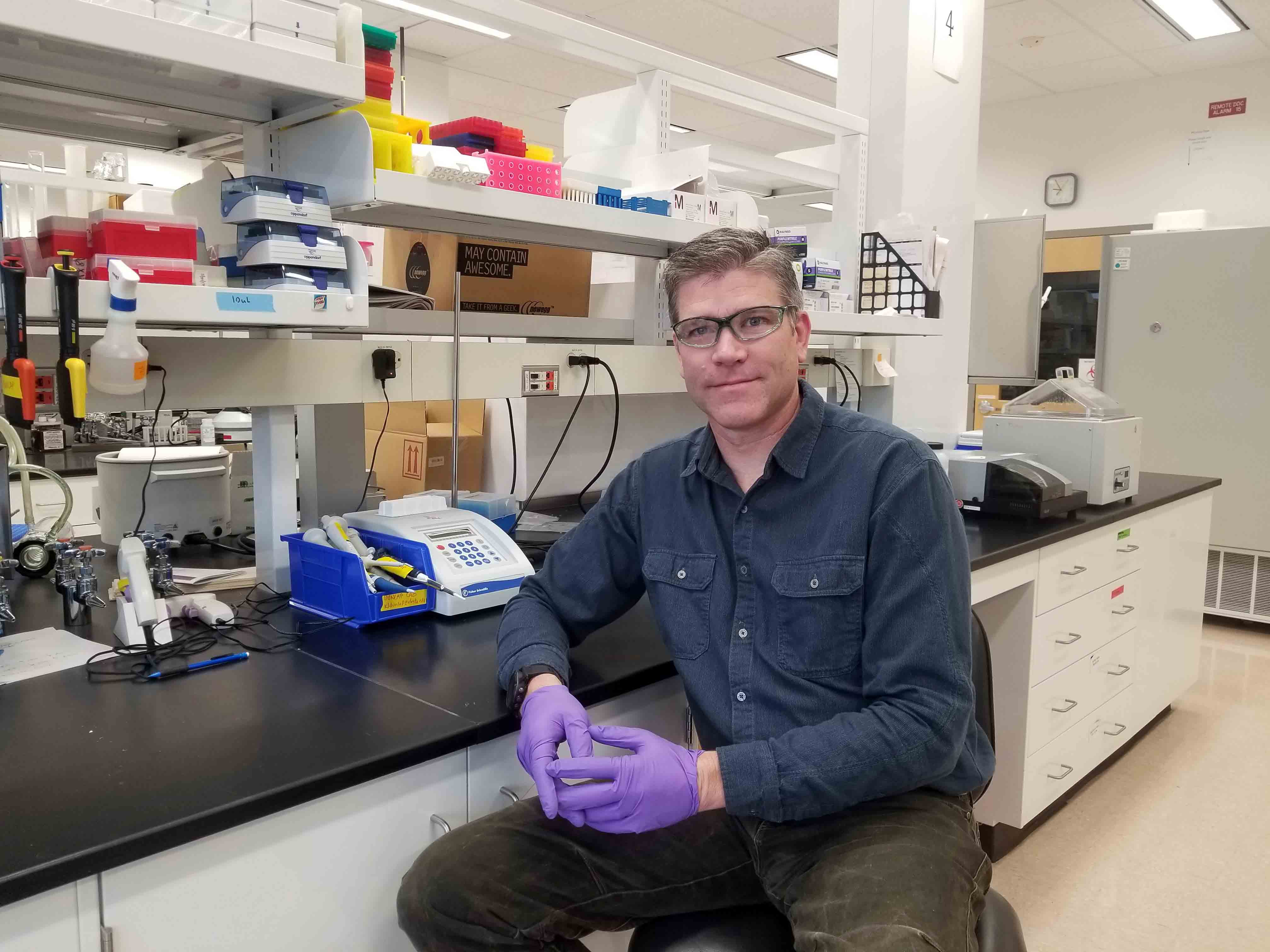 PhD Candidate Scott Jerome in his laboratory. Photo Amanda Byrd/OIPC