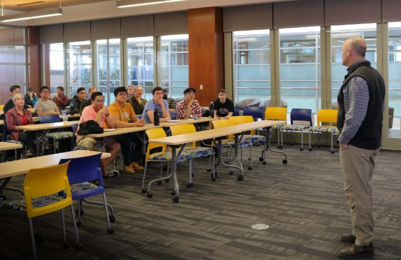 Dr. Robert Coker describes his hacking for Defense class during the IDEAs Awards. Photo courtesy of Amanda Byrd.