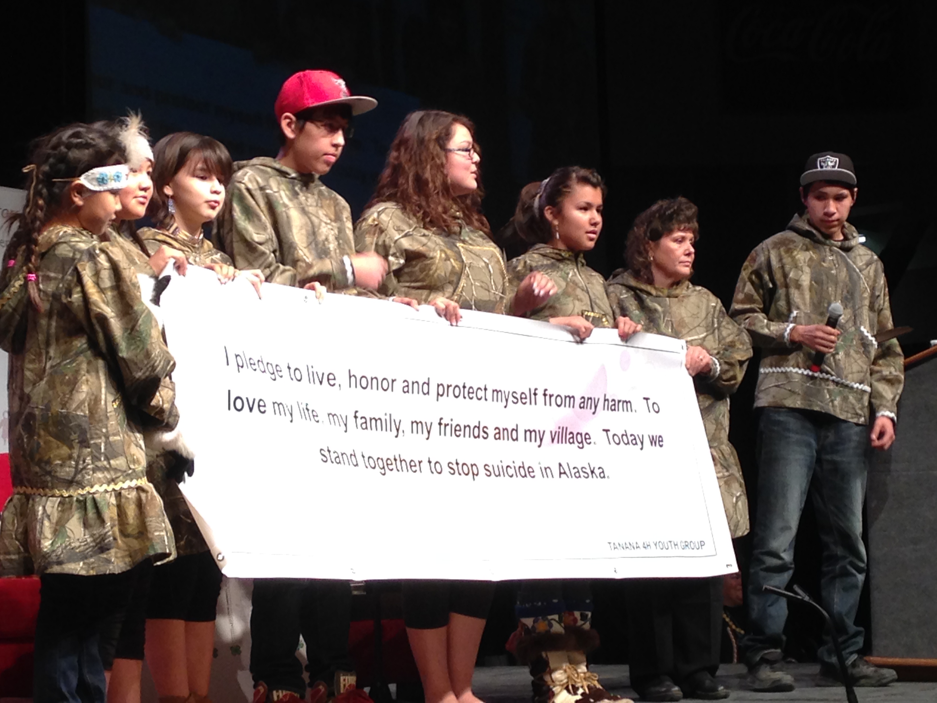 Members of a Tanana 4-H club display their anti-suicide pledge at the Elders and Youth Conference in Fairbanks.