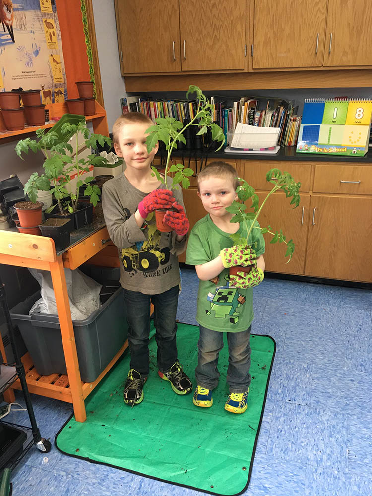 Children holding plants