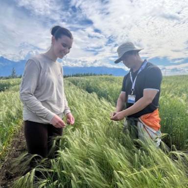 Intern working with host in a field-based internship