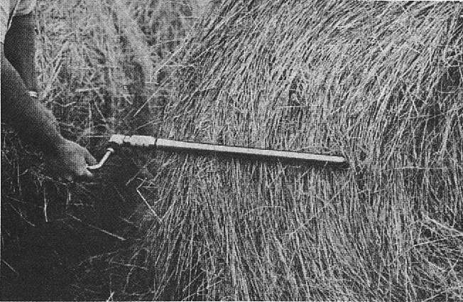 Sample round bales with a core sampler and insert at rightangle to the wrap.