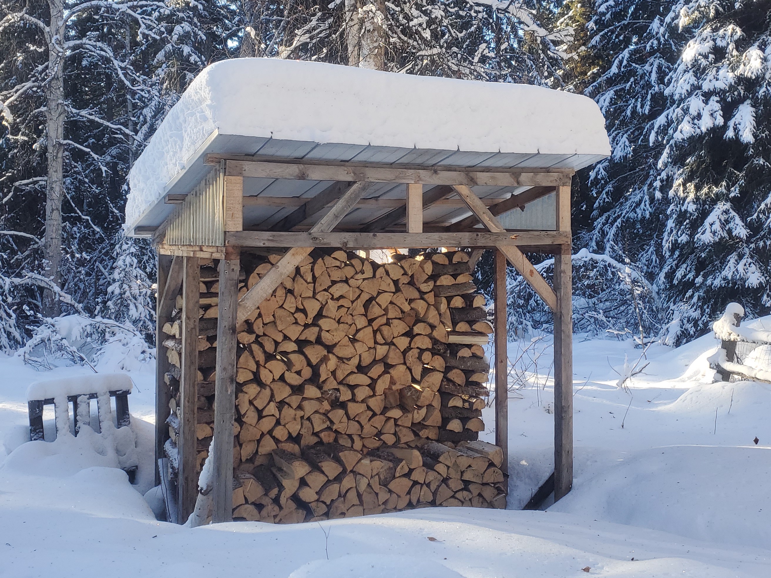 Wood shed in the snow