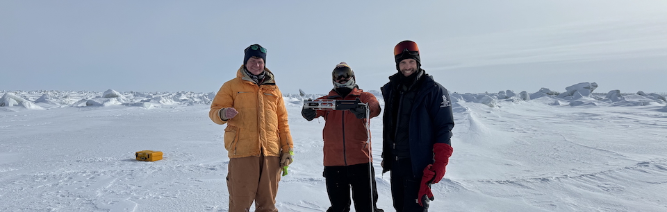 Professor Steven Dykstra on an ice field with students, conducting research