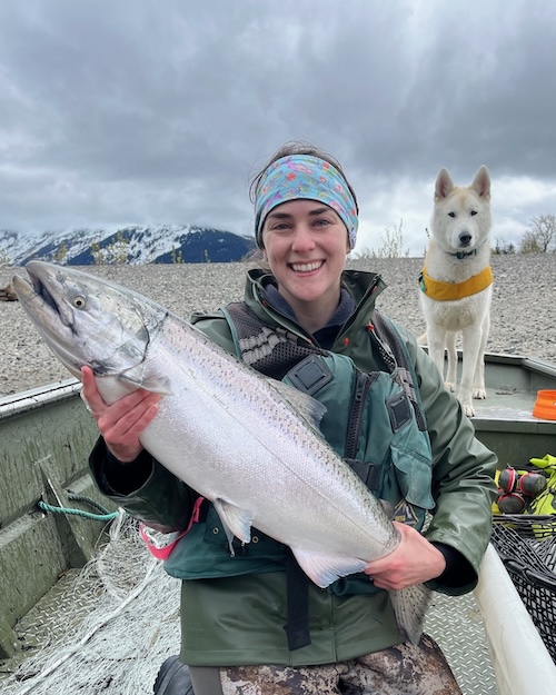 Darion Jones smiling while holding a salmon